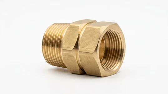 CNC machined brass plumbing fitting with clean chamfers
