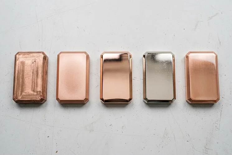 Copper surface finishes samples including as-machined, bead blasted, polished, and nickel plated